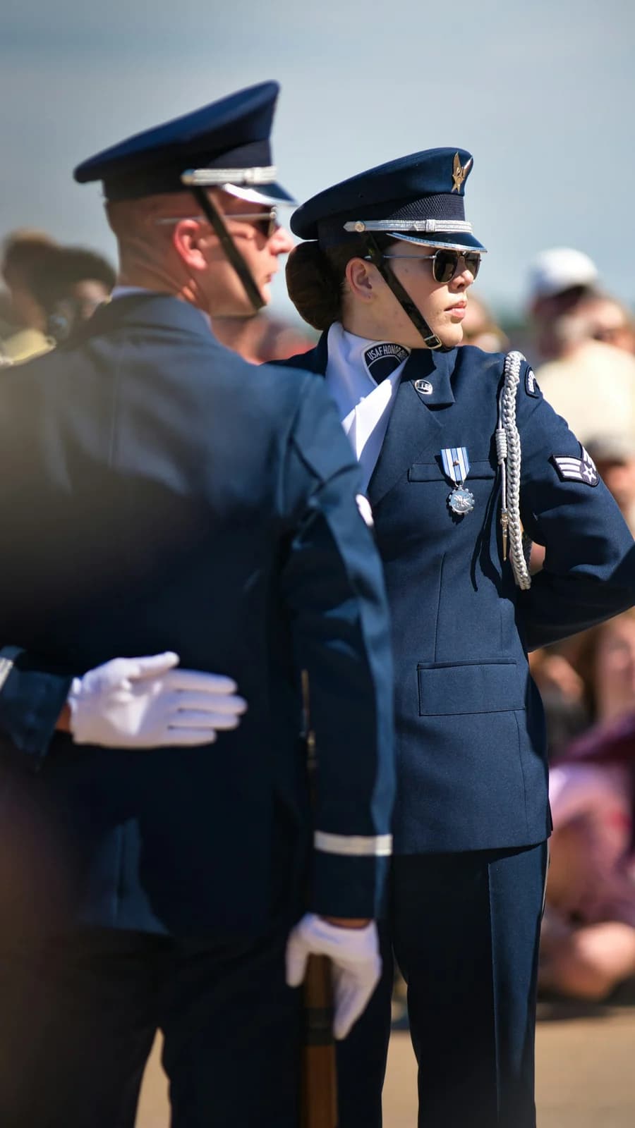 Service member in dress uniform displaying medals and ribbon bars